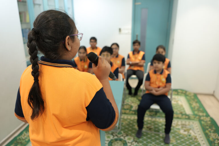 Zack's open schooling center encouraging public speaking for children