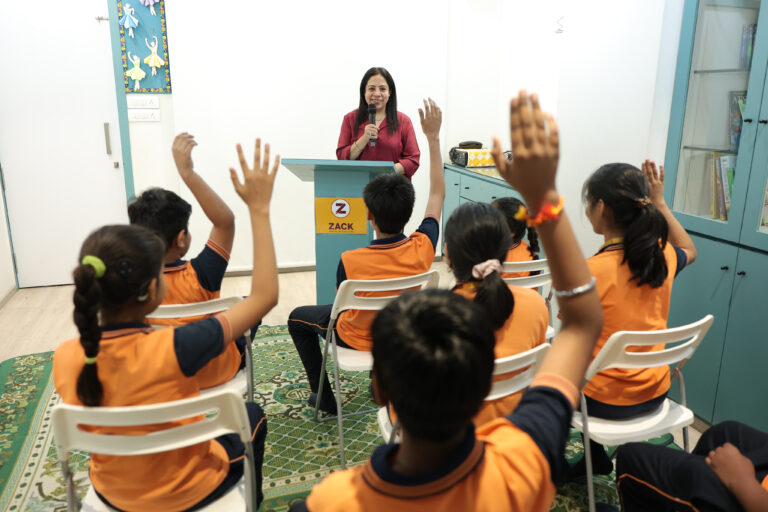 Teacher addressing queries of students at the open schooling center at Zack