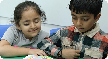 Small children enjoying reading session at Zack's tuition classes for children