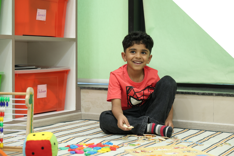 Child enjoying the learning and fun environment at Zack education center
