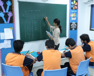 Teacher teaching students at open schooling center in Surat