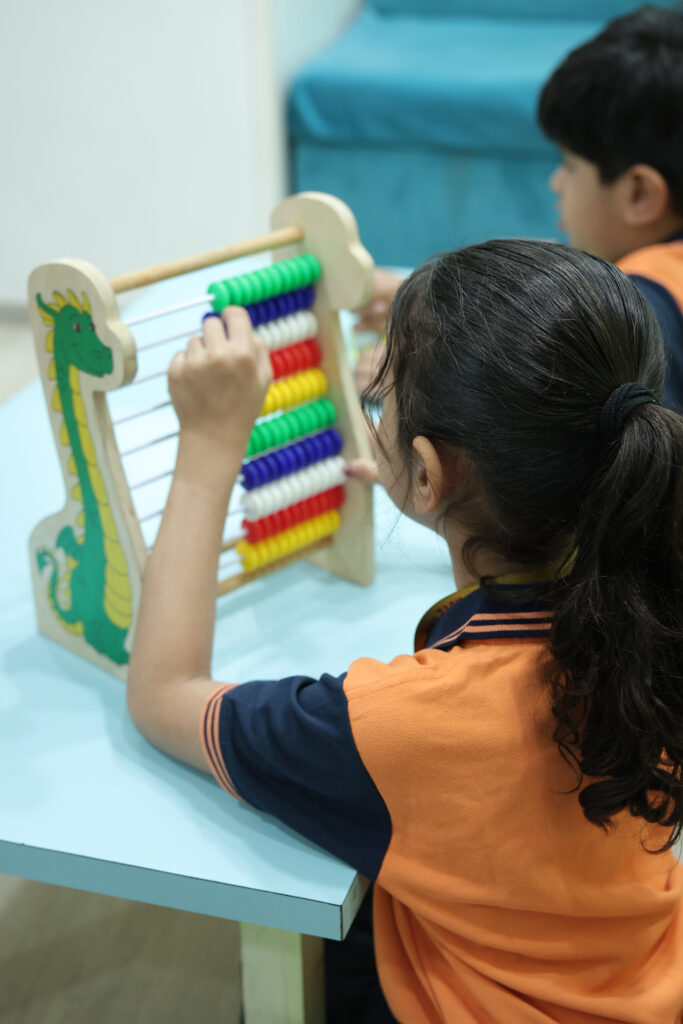 Students learning via educational games at Zack's open school center, Surat