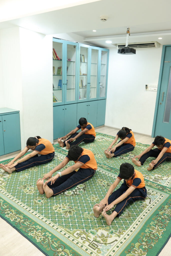 Students engrossed in watching an educational film at the audio-visual room