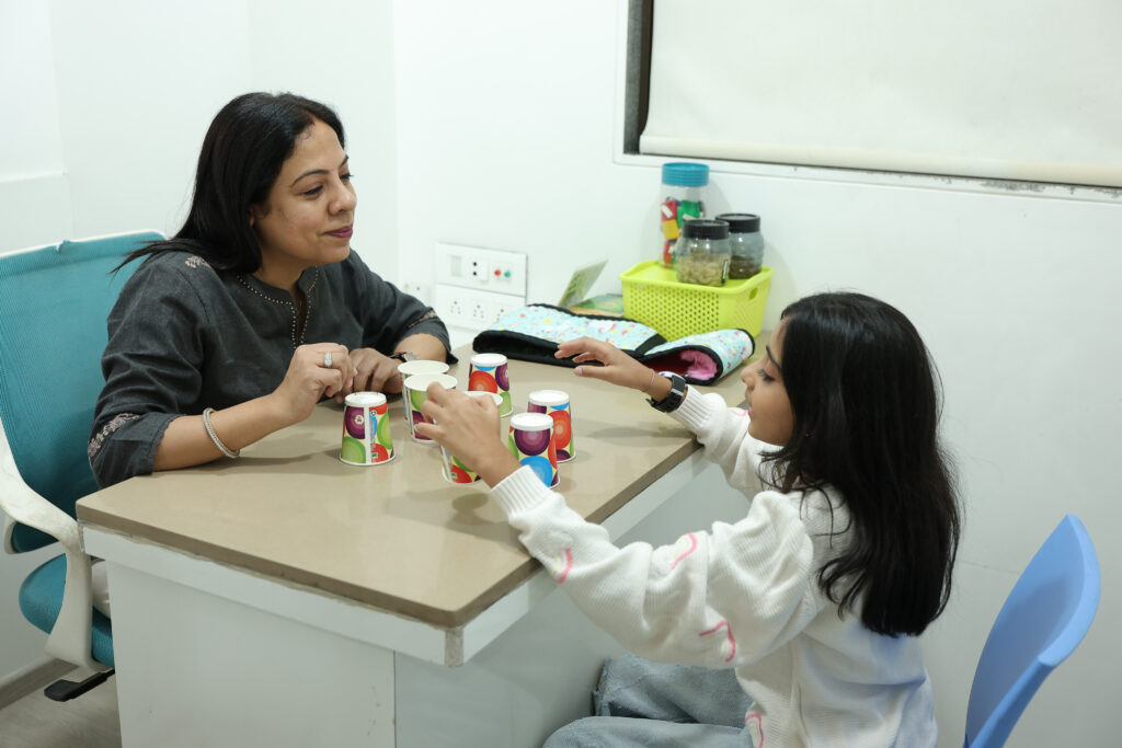 Special education class with one-on-one session between a teacher and child