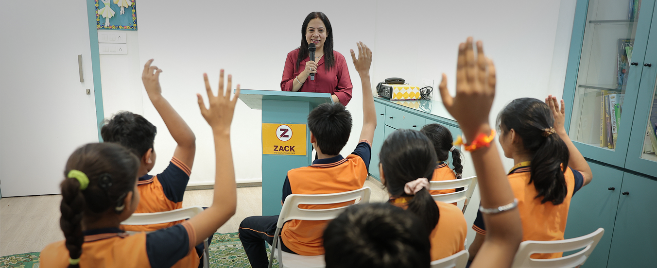 Teacher addressing students at Zack's open school center in Surat
